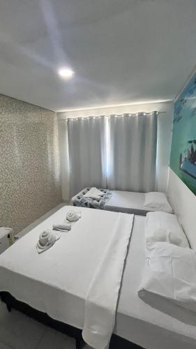 Postel nebo postele na pokoji v ubytování pousada agua viva