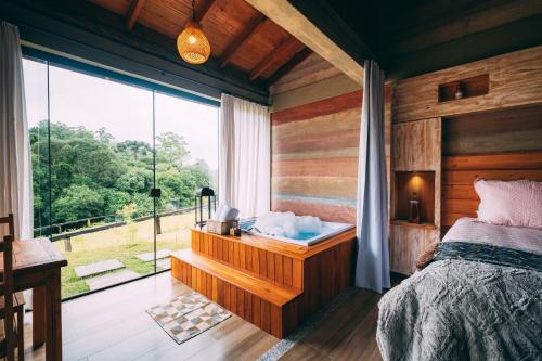 Ένα ή περισσότερα κρεβάτια σε δωμάτιο στο Pousada Trem Chic