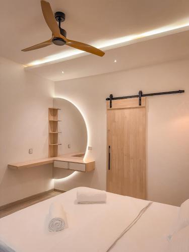 Llit o llits en una habitació de Cocomero Inn