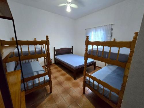 En eller flere senge i et værelse på Casa no Centro 600m da Praia