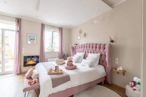 En eller flere senge i et værelse på La bulle romantique