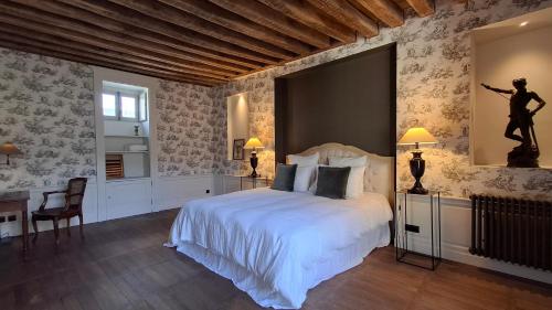 En eller flere senge i et værelse på Hôtel Savare