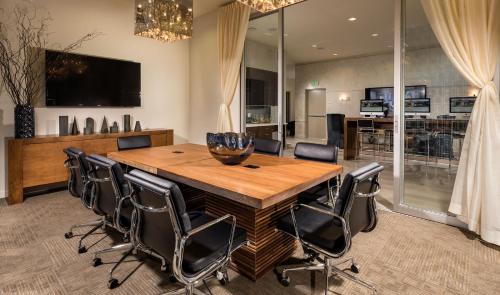 a dining room with a wooden table and chairs at DTLA prime one bedroom steps away from Crypto in Los Angeles