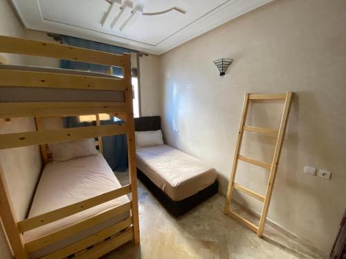 Postel nebo postele na pokoji v ubytování Hostel Mirleft