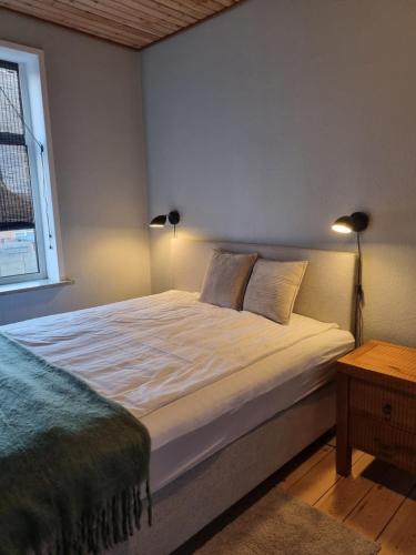 En eller flere senge i et værelse på Stay in Graasten - surrounded by royal peace and history