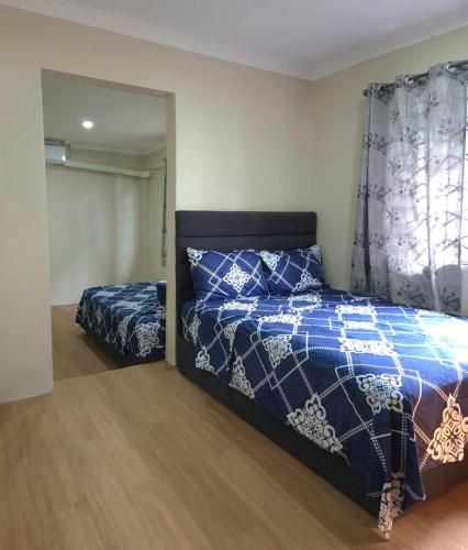 Postel nebo postele na pokoji v ubytování ZEG Homestay