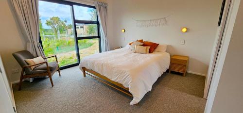 En eller flere senge i et værelse på The Wine Shed