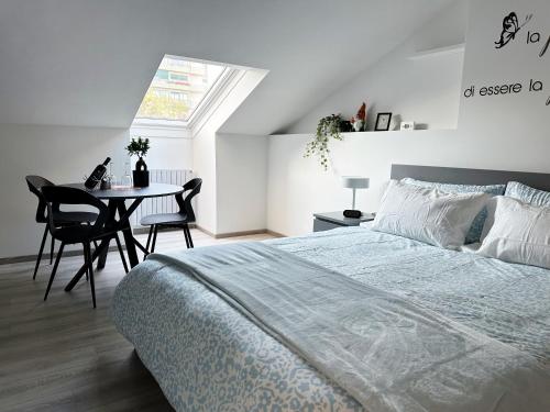 En eller flere senge i et værelse på Turin Dreams