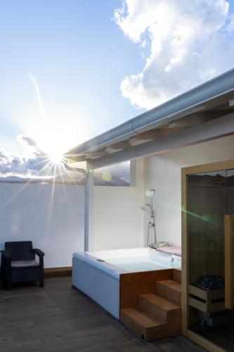 a room with a bed with the sun in the sky at Skyline Boutique Hotel in Palermo