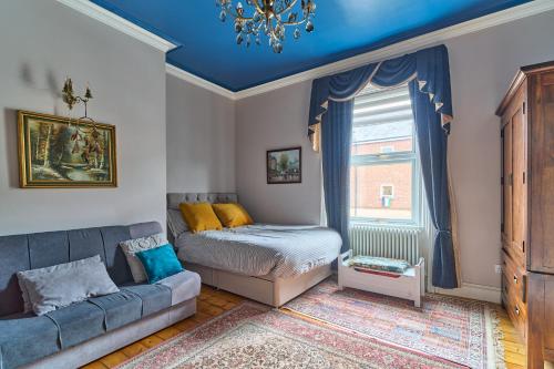 a living room with a couch and a bed at Home in Newcastle upon Tyne in Gosforth