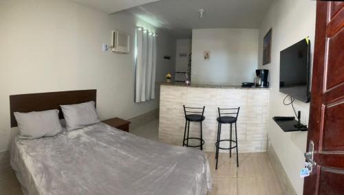 En eller flere senge i et værelse på Caminho do mirante, suíte 5