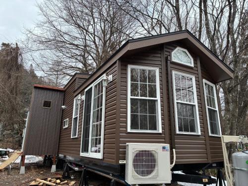 a tiny house is being built on a trailer at Hakuba Canadian Lodge in Hakuba