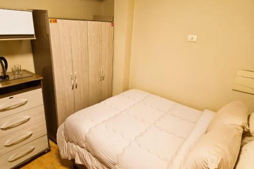 Postel nebo postele na pokoji v ubytování Central Urbano CDE