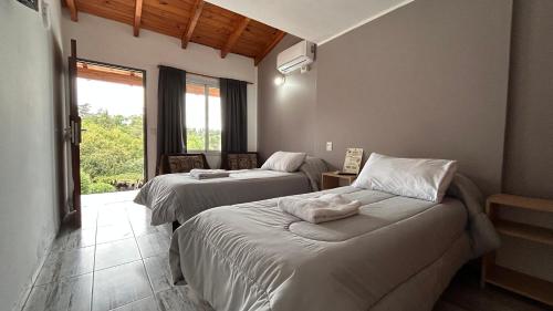 Postel nebo postele na pokoji v ubytování CabañPuente