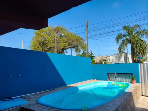 Swimmingpoolen hos eller tæt på Casa com piscina próxima ao centro de eventos Marisol