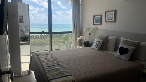 En eller flere senge i et værelse på Barra Home Stay Flat