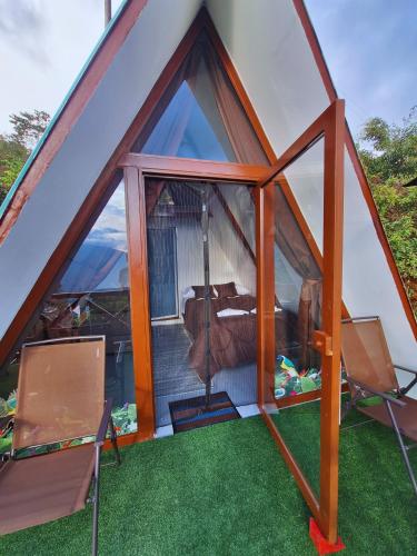 a large tent with a living room in it at Chalet Maranatha Vista Única Represa de Chivor in Macanal
