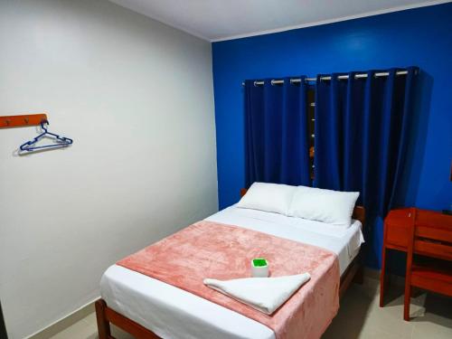 Giường trong phòng chung tại Alojamiento Oslo San Ramón