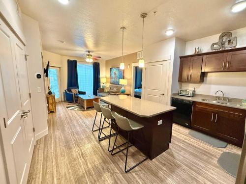 a kitchen with a island in the middle of a room at Spacious 2-Bedroom Urban Oasis in Salt Lake City