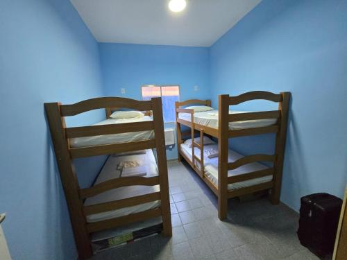 En eller flere senge i et værelse på Pousada Hostel Beach Pajuçara