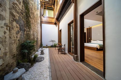 En eller flere senge i et værelse på Huangshan Bajiazhan Yulin Yuchi Homestay