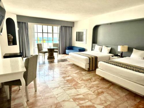 Giường trong phòng chung tại Hotel y Museo Casa Turquesa