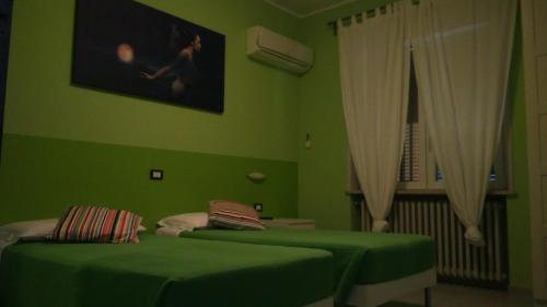 Ένα ή περισσότερα κρεβάτια σε δωμάτιο στο La Quercia Hotel con Ristorante