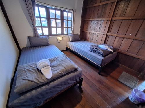 En eller flere senge i et værelse på Sleep in Town