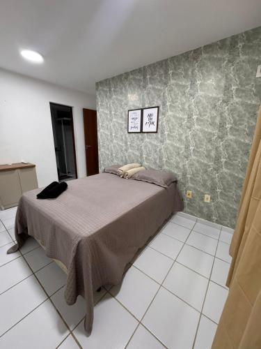 En eller flere senge i et værelse på Ap 1km da praia com suite