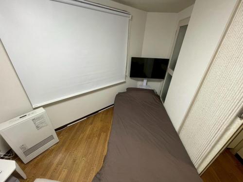 TV a/nebo společenská místnost v ubytování Odori Park Soba Sapporo, Susuki Convenient for sightseeing 1R Highway 702