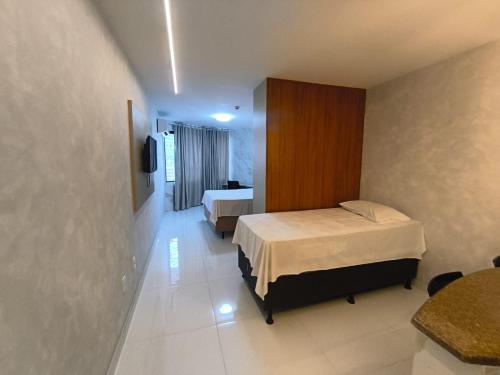 En eller flere senge i et værelse på Victory Preminum