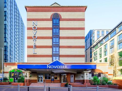 a building with a no world sign in front of it at Novotel Birmingham Centre in Birmingham