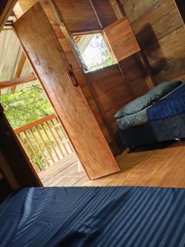 a view of a room with a door and a bed at Cabaña Campestre - La Gloria in Guadalupe