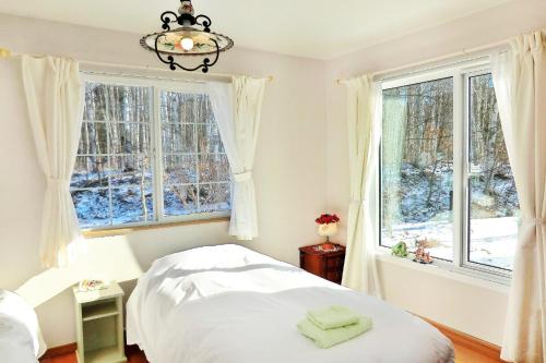 Postel nebo postele na pokoji v ubytování Asahikawa - house / Vacation STAY 5789