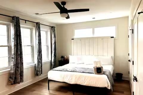 a bedroom with a bed with a ceiling fan at 35 Room 1 - 1 King Bed, Private Bathroom - Nonsmoking in Arlington