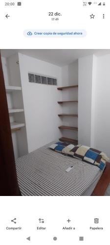 En eller flere senge i et værelse på Apto 3 habitaciones