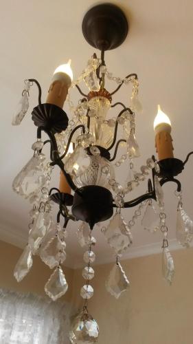 a black chandelier hanging from a ceiling at Belle Vue Guesthouse in Hermanus