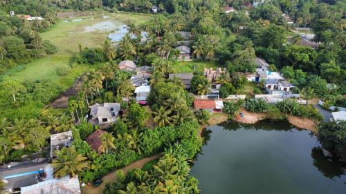 an aerial view of a house with a lake at Green Bird in Mirissa