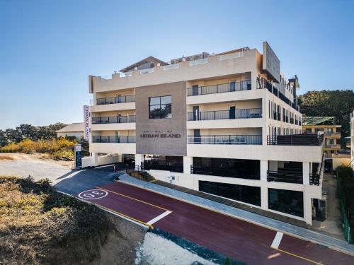 a building with a parking lot in front of it at Daebudo Urban Island in Ansan