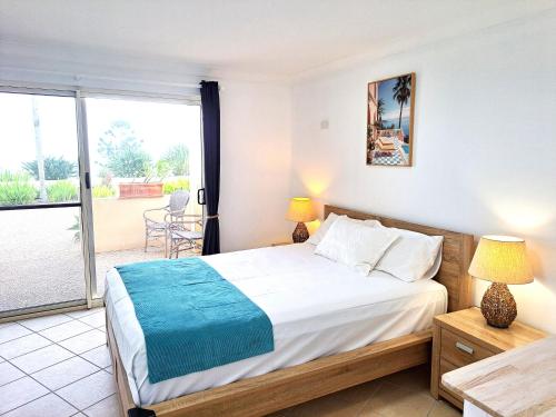 En eller flere senge i et værelse på Villa Mar Colina