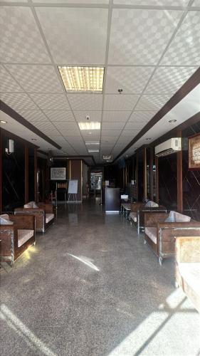 a large room with many beds in a building at شموخ العلياء للشقق المخدومة in Al Jith