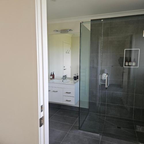 a bathroom with a shower and a sink at Fairhall view in Marlborough Airport