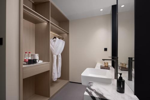 Koupelna v ubytování 上饶鹿华摹尔酒店经济开发区吾悦广场店