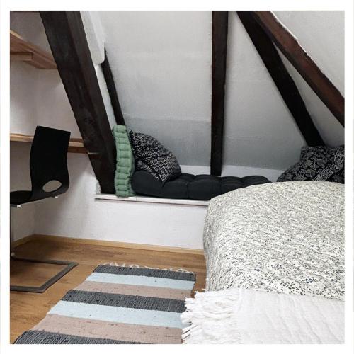 a bedroom with a window with a bed and a rug at Studio Homebase in Spittal an der Drau