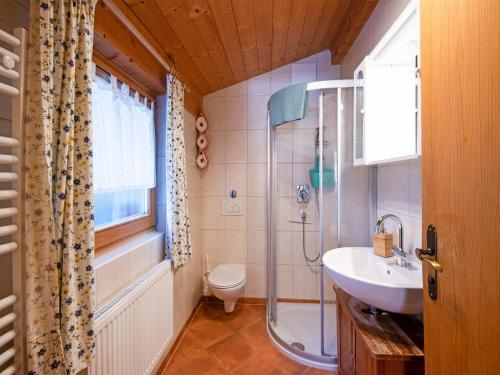 a bathroom with a shower and a toilet and a sink at Chalet in Hochfügen near Ski Slopes in Hochfugen
