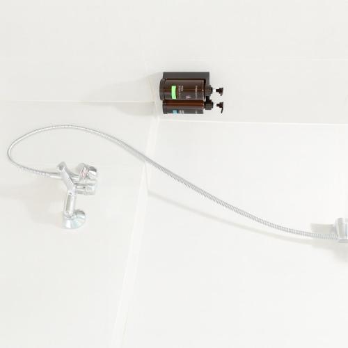 a white cabinet with a shower head and a shower at The Artha - Bandung in Bandung