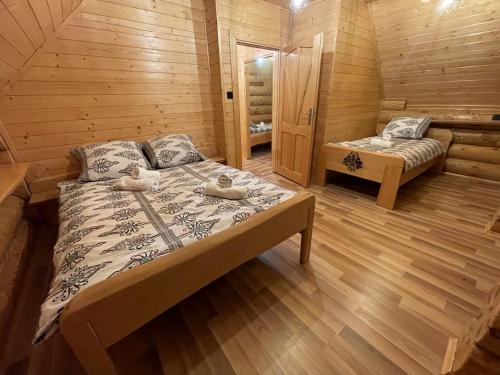 En eller flere senge i et værelse på Bali domy RESTORT & SPA