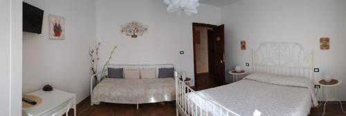 Ένα ή περισσότερα κρεβάτια σε δωμάτιο στο B&B La poeta