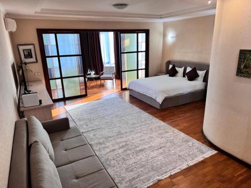 En eller flere senge i et værelse på Apart Hotel 5