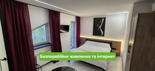 En eller flere senge i et værelse på Afina center apartment